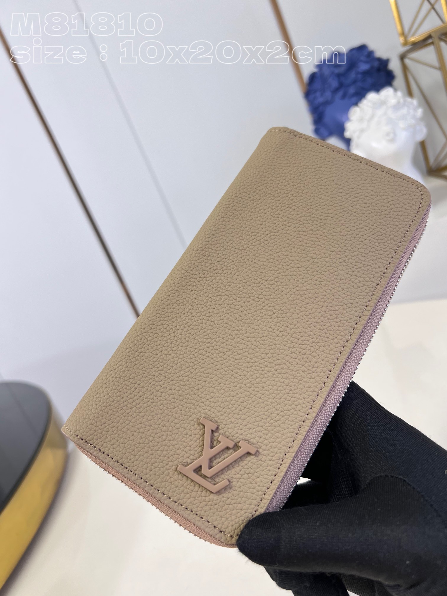 Louis Vuitton M81810 Apricot LV Aerogram leather gives the zippy bag an understated style and