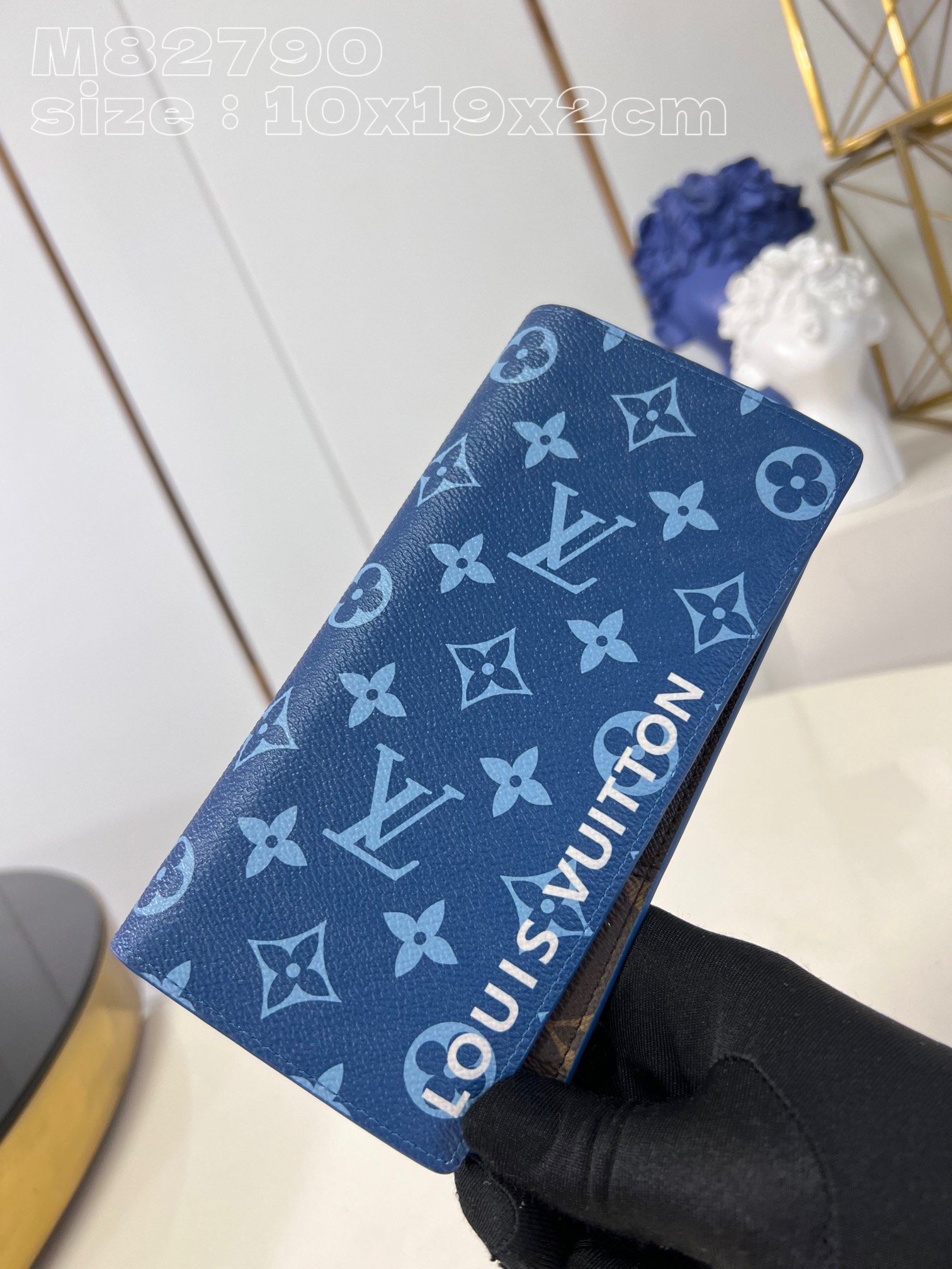Louis Vuitton M82790 Blue Brazza wallet in Monogram-coated canvas with a color-blocked interior