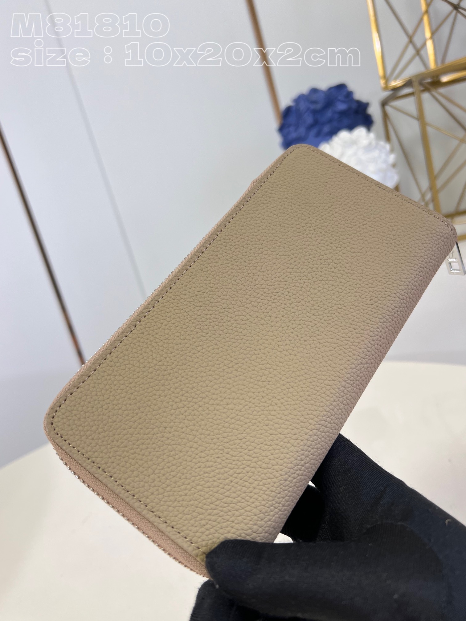 Louis Vuitton M81810 Apricot LV Aerogram leather gives the zippy bag an understated style and