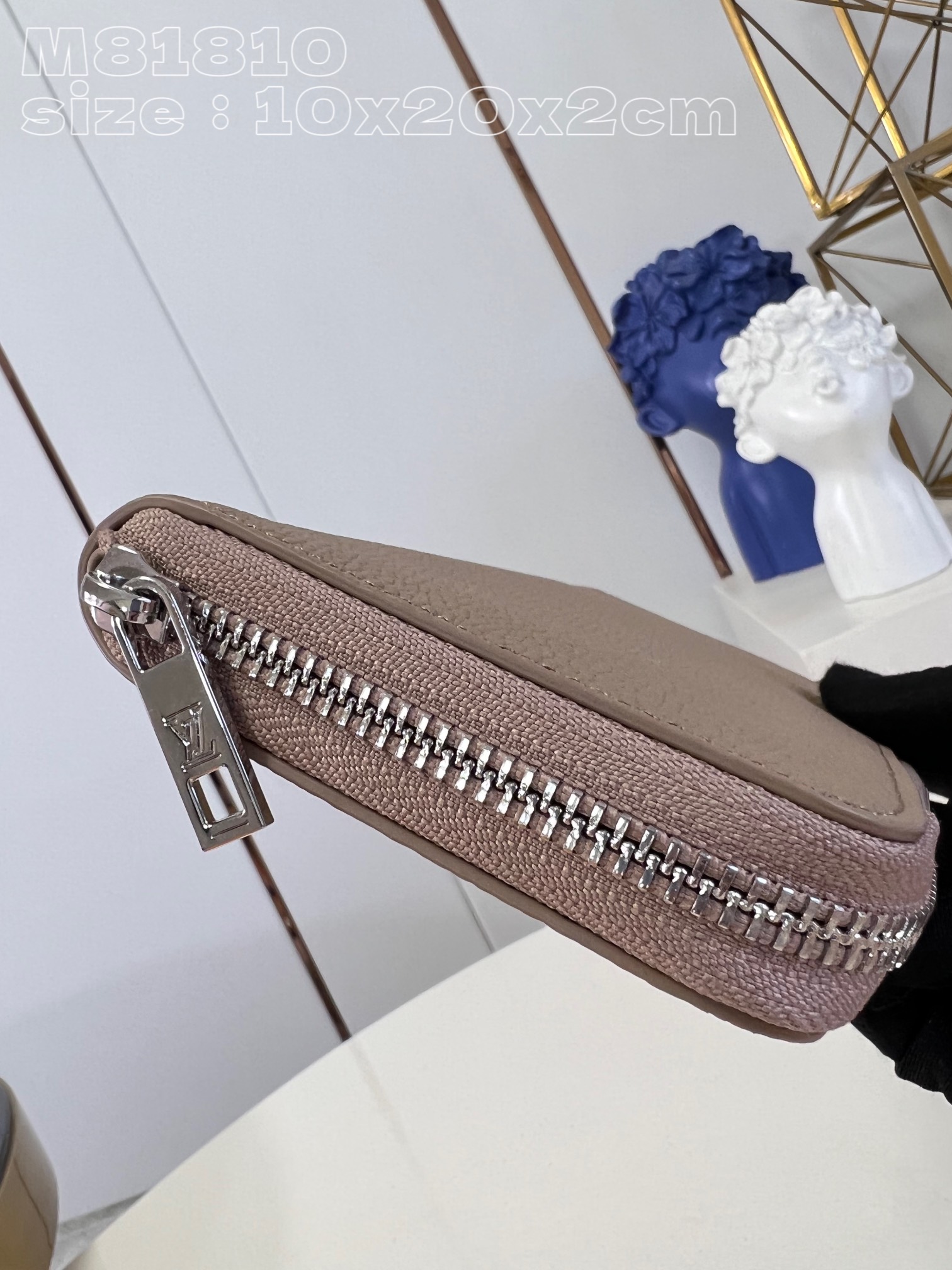 Louis Vuitton M81810 Apricot LV Aerogram leather gives the zippy bag an understated style and