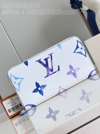 Louis Vuitton M82384 zippy wallet in blue is made of canvas with an oversized monogram pattern