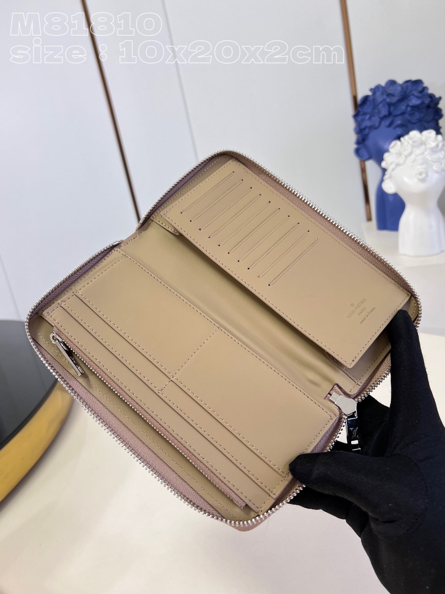 Louis Vuitton M81810 Apricot LV Aerogram leather gives the zippy bag an understated style and