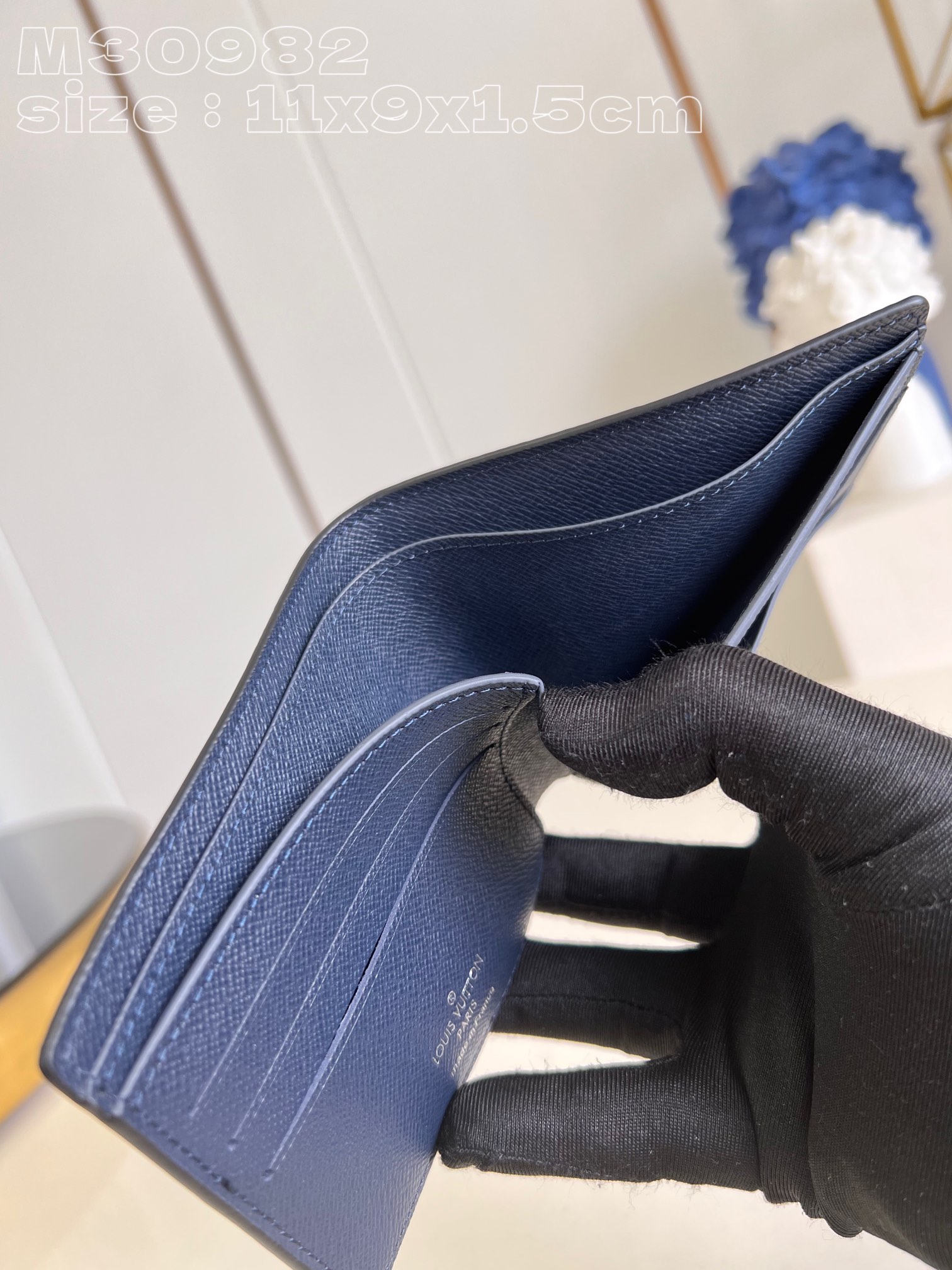 Louis Vuitton M30982 Dark blue Multiple wallet in Taga cowhide leather is a minimalist design with