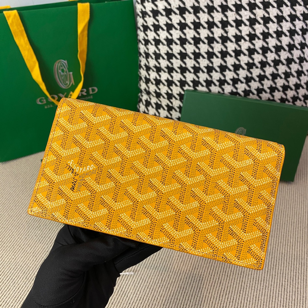 yellow goyard Richelieu Wallet a long wallet that fastens with a snap fastener