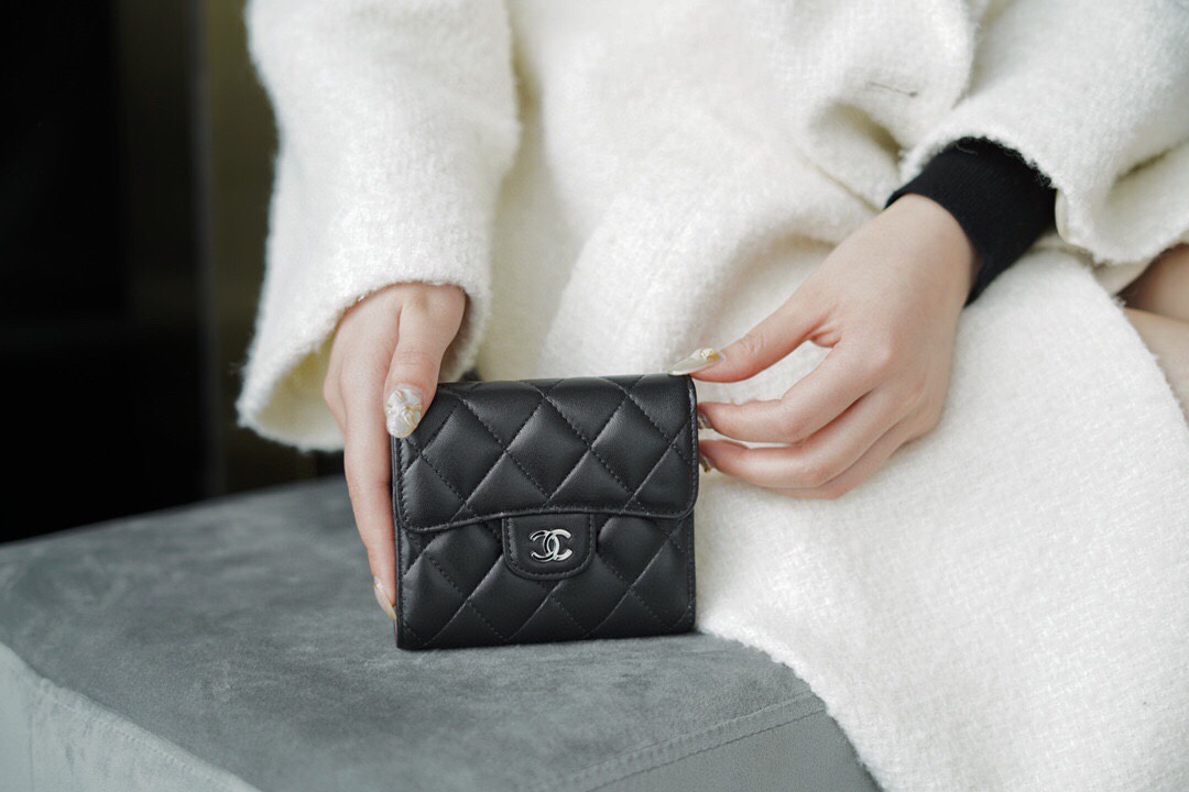 Chanel classic trifold short clip black lamb silver delicate lambskin has a kind of innate charm