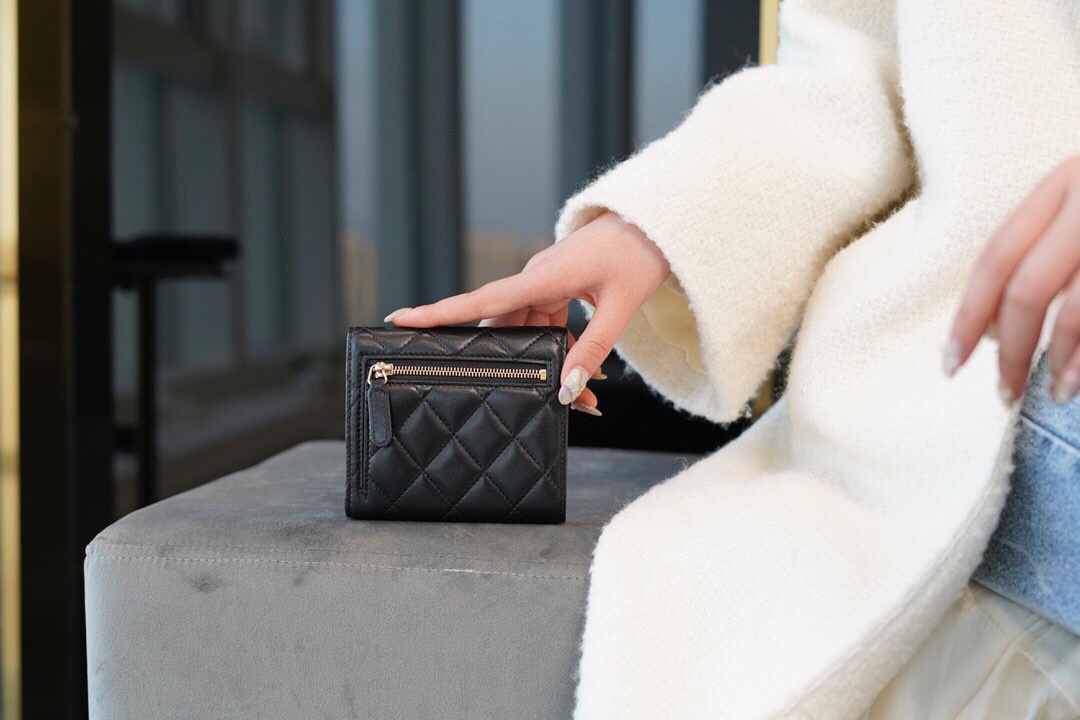 Chanel classic trifold short clip black sheep gold delicate lambskin has a kind of innate charm