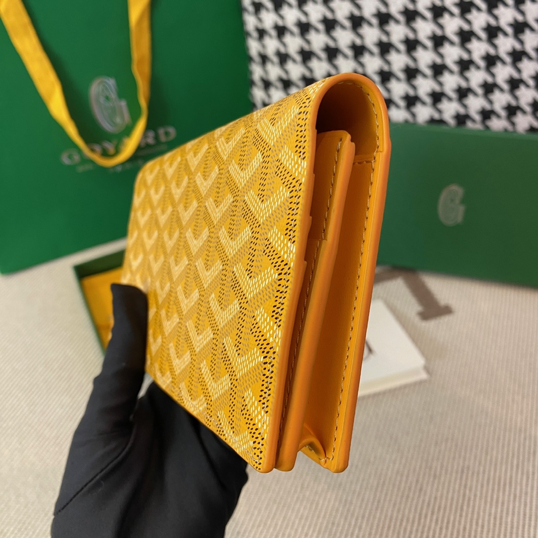 yellow goyard Richelieu Wallet a long wallet that fastens with a snap fastener