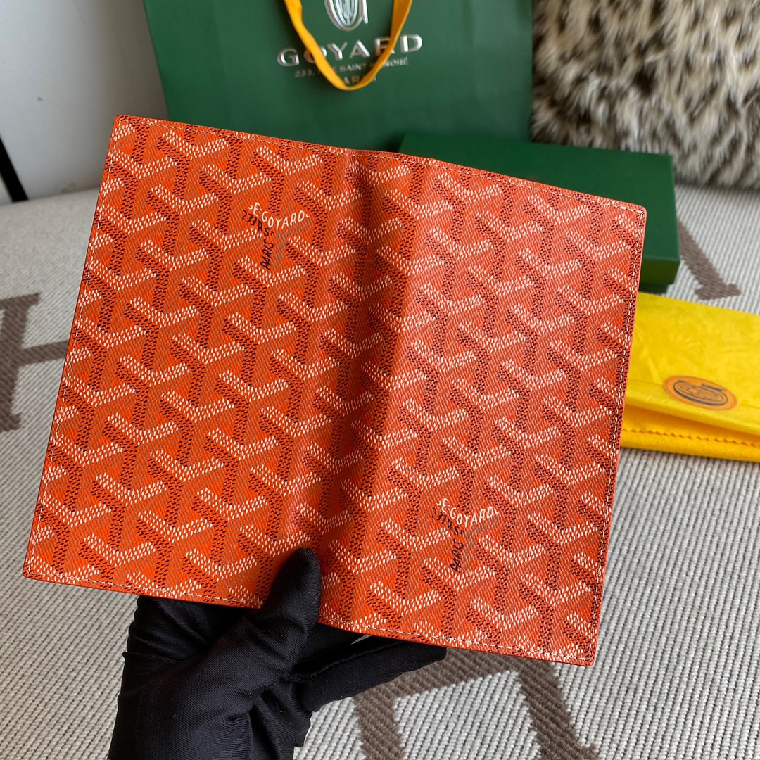 Orange Goyard Saint-Lambert Wallet is a universal phone case with all the everyday essentials in one