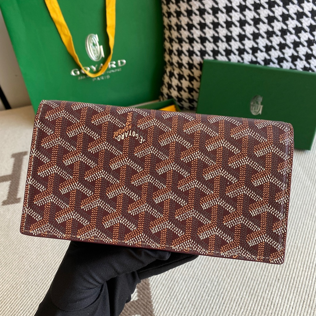 burgundy goyard Richelieu Wallet a long wallet that fastens with a snap fastener