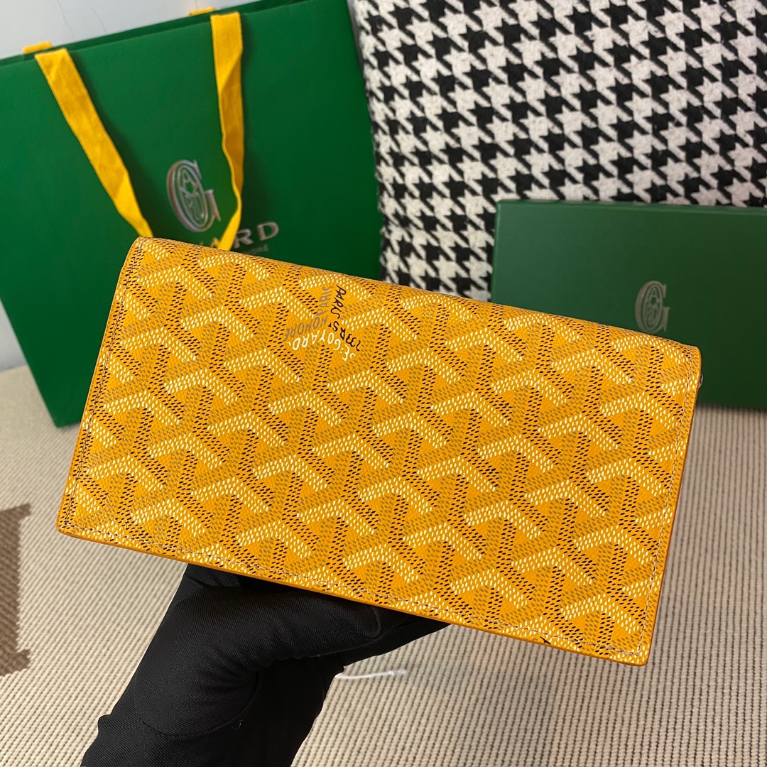 yellow goyard Richelieu Wallet a long wallet that fastens with a snap fastener