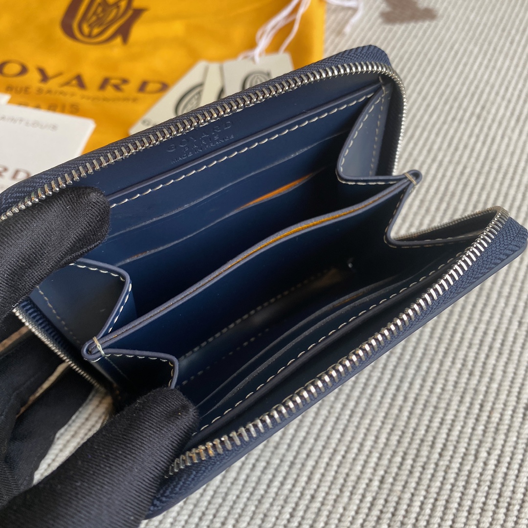 Navy Goyard Matignon PM Wallet is a compact shape and closes securely with a zip