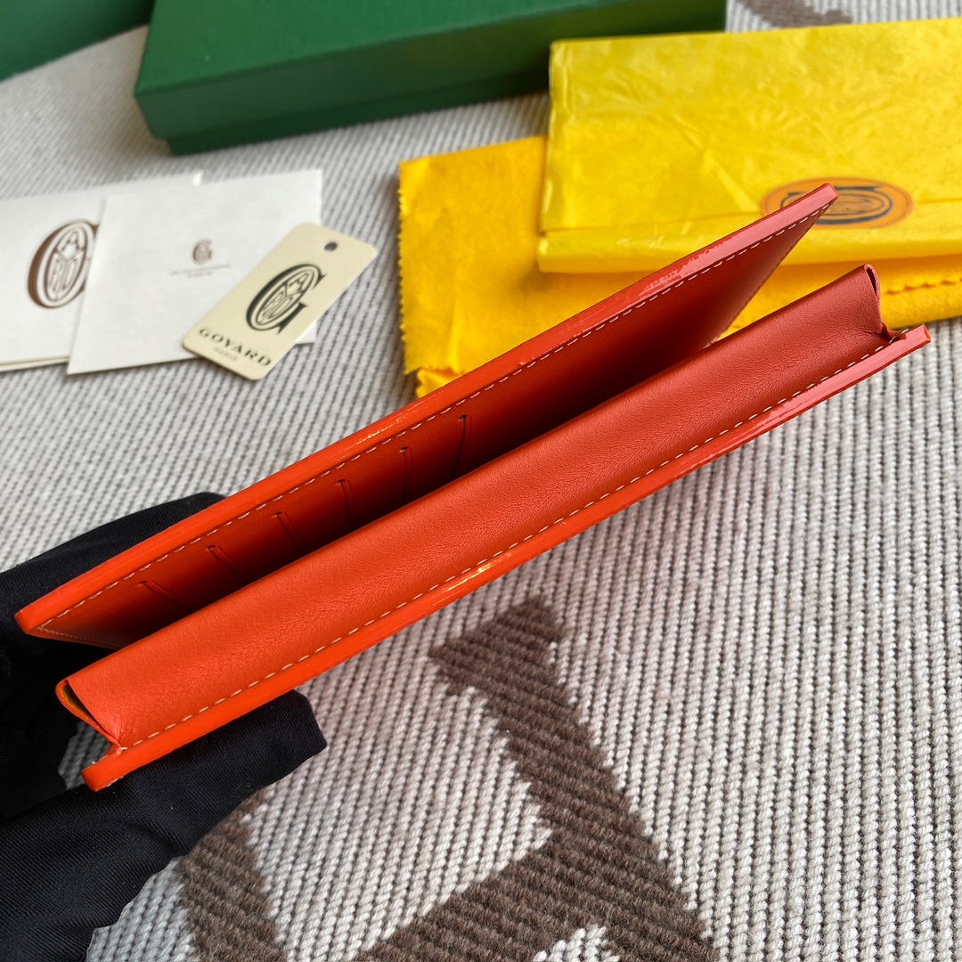 Orange Goyard Saint-Lambert Wallet is a universal phone case with all the everyday essentials in one