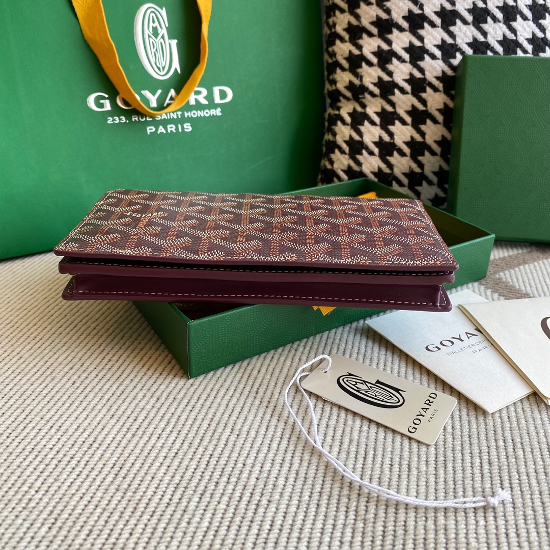 burgundy goyard Richelieu Wallet a long wallet that fastens with a snap fastener