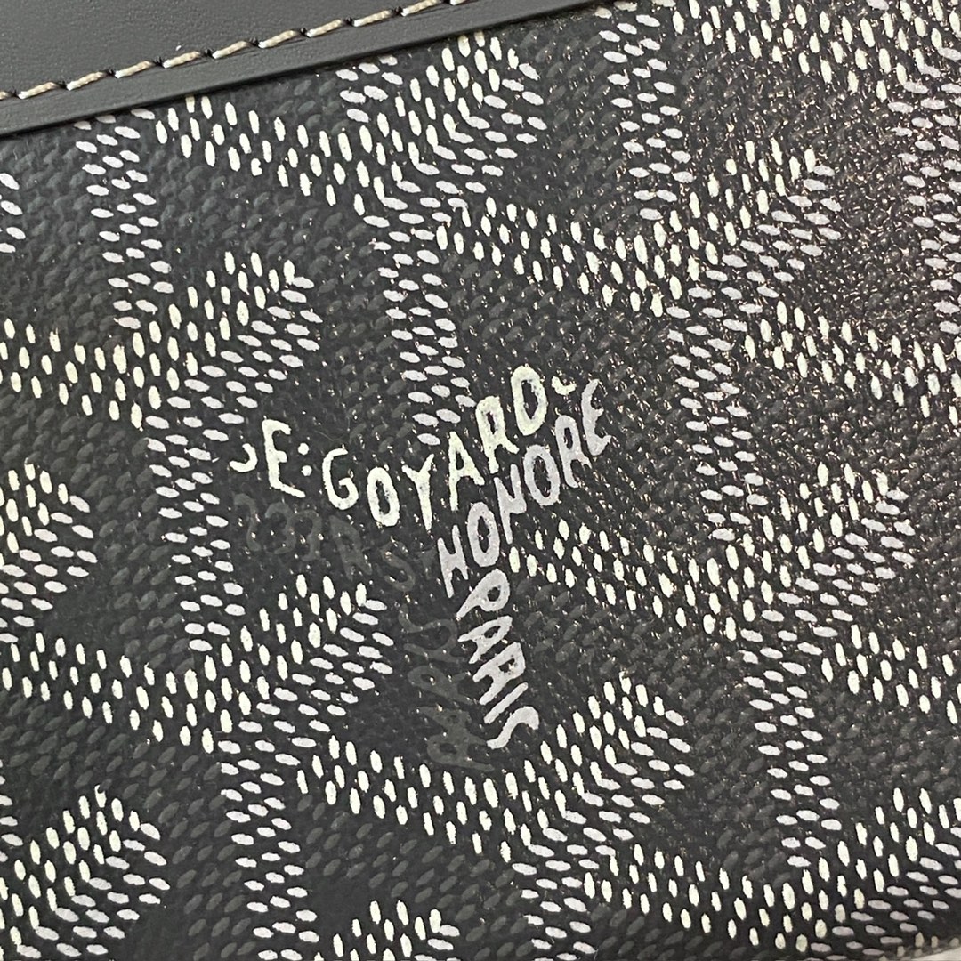 grey Goyard Matignon PM Wallet is a compact shape and closes securely with a zip