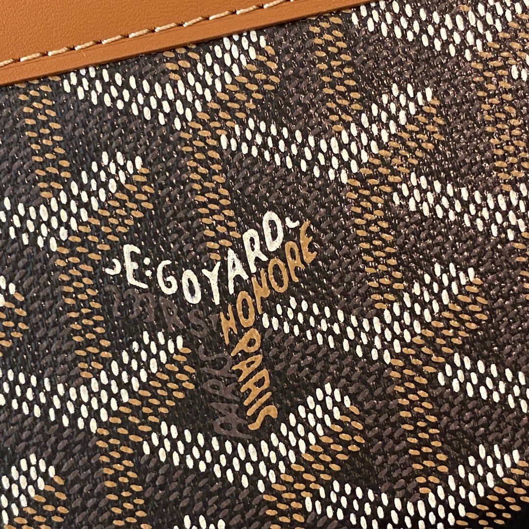 Black and tan Goyard Matignon PM Wallet is a compact shape and closes securely with a zip