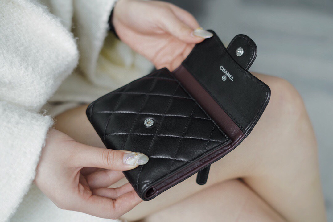Chanel classic trifold short clip black lamb silver delicate lambskin has a kind of innate charm
