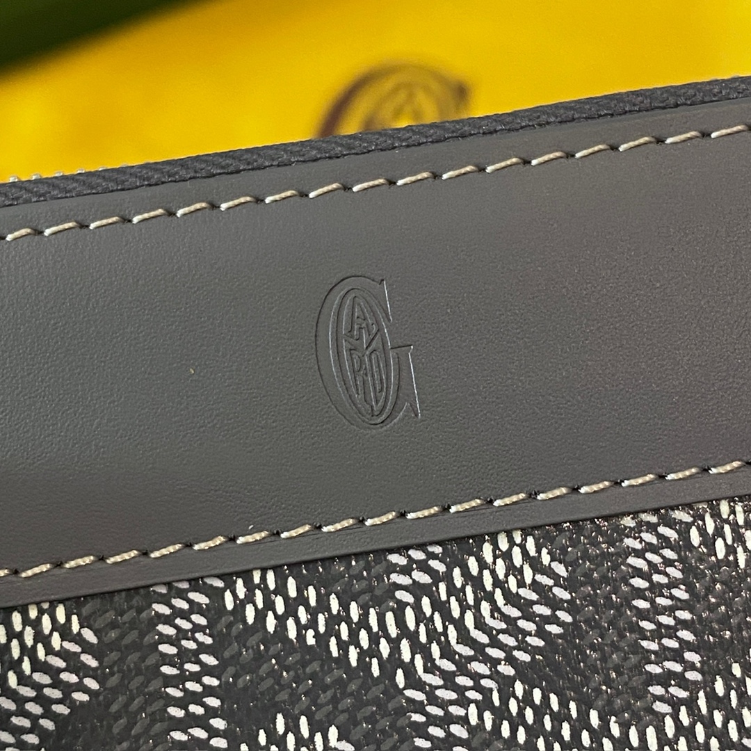 grey Goyard Matignon PM Wallet is a compact shape and closes securely with a zip