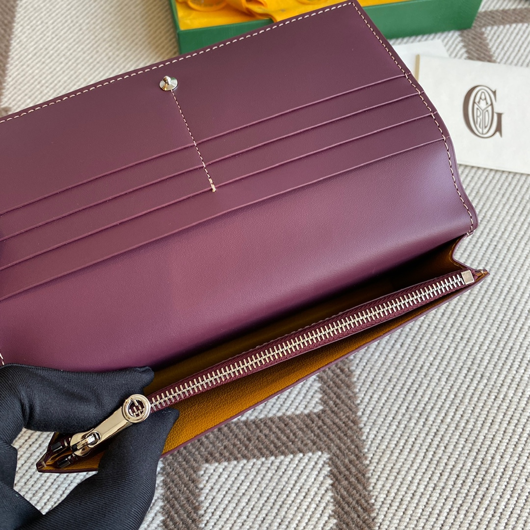burgundy goyard Richelieu Wallet a long wallet that fastens with a snap fastener