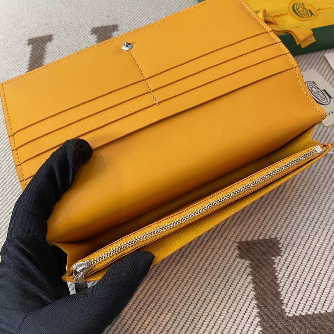 yellow goyard Richelieu Wallet a long wallet that fastens with a snap fastener