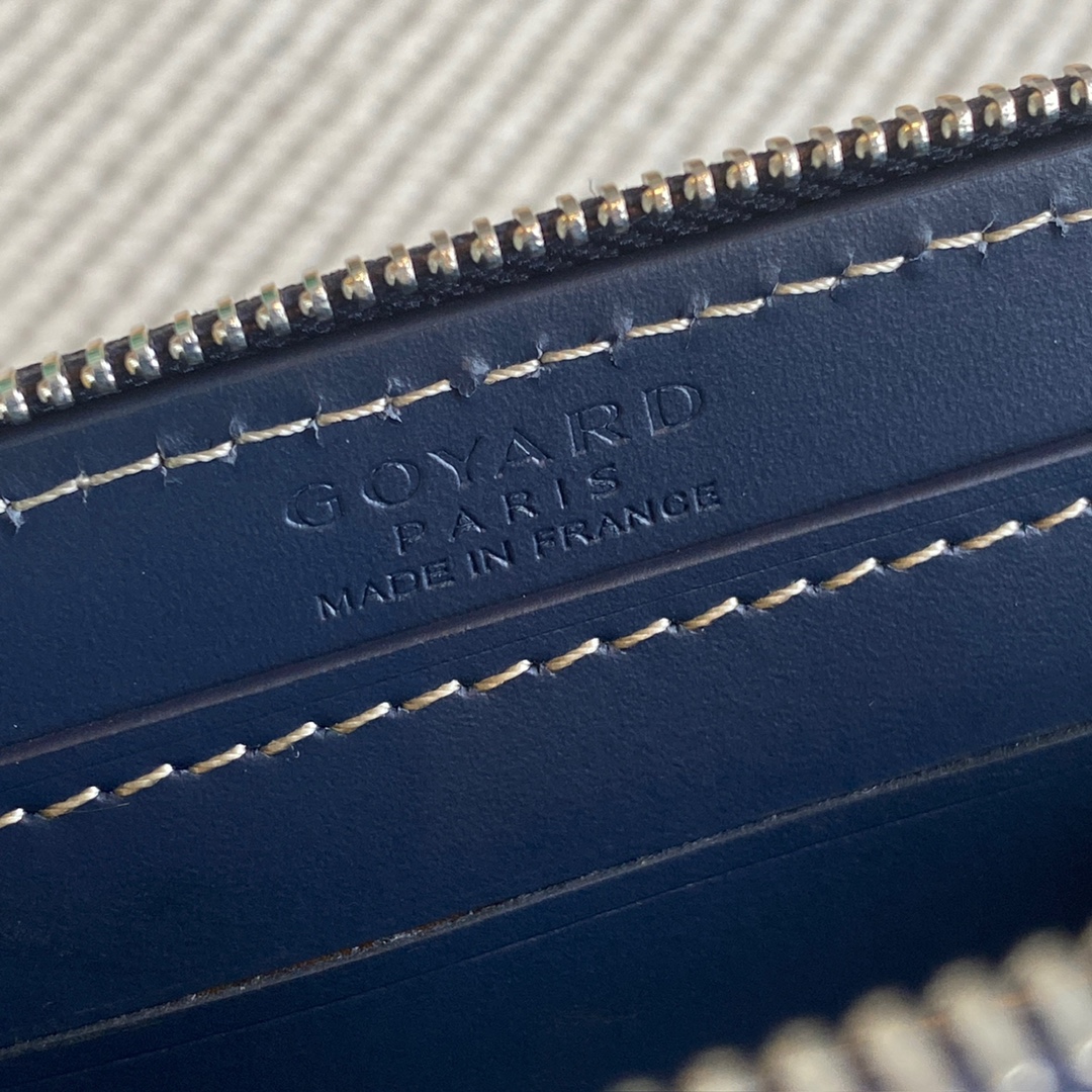 Navy Goyard Matignon PM Wallet is a compact shape and closes securely with a zip