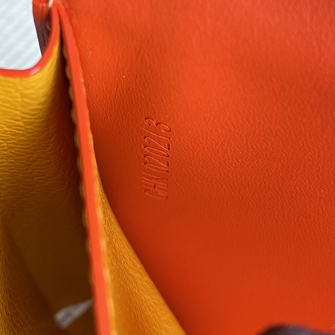 Orange Goyard Saint-Lambert Wallet is a universal phone case with all the everyday essentials in one