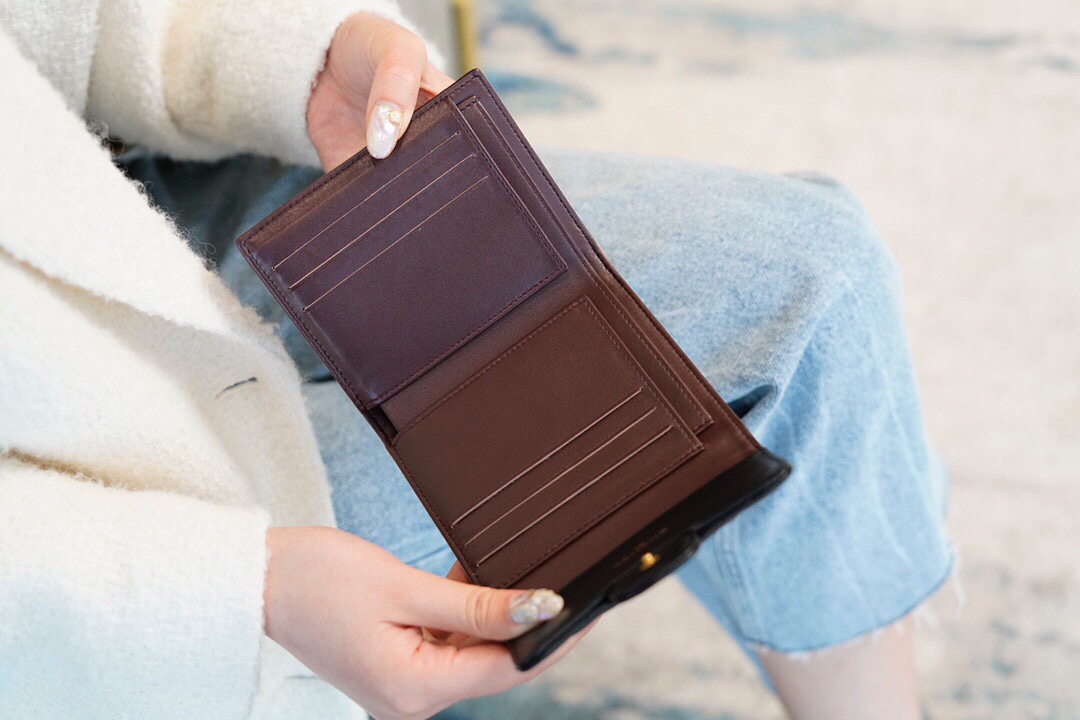 Chanel classic trifold short clip black sheep gold delicate lambskin has a kind of innate charm