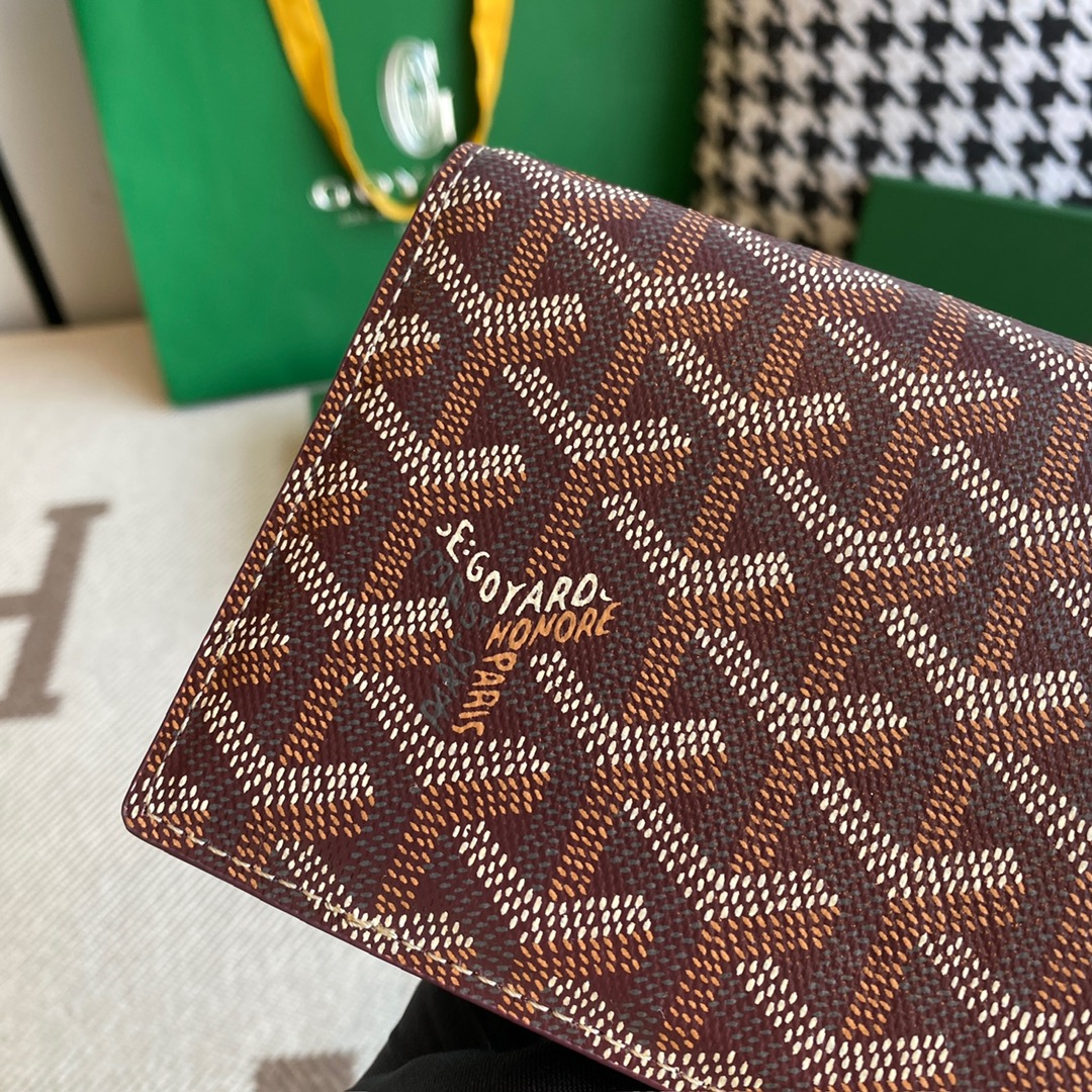 burgundy goyard Richelieu Wallet a long wallet that fastens with a snap fastener