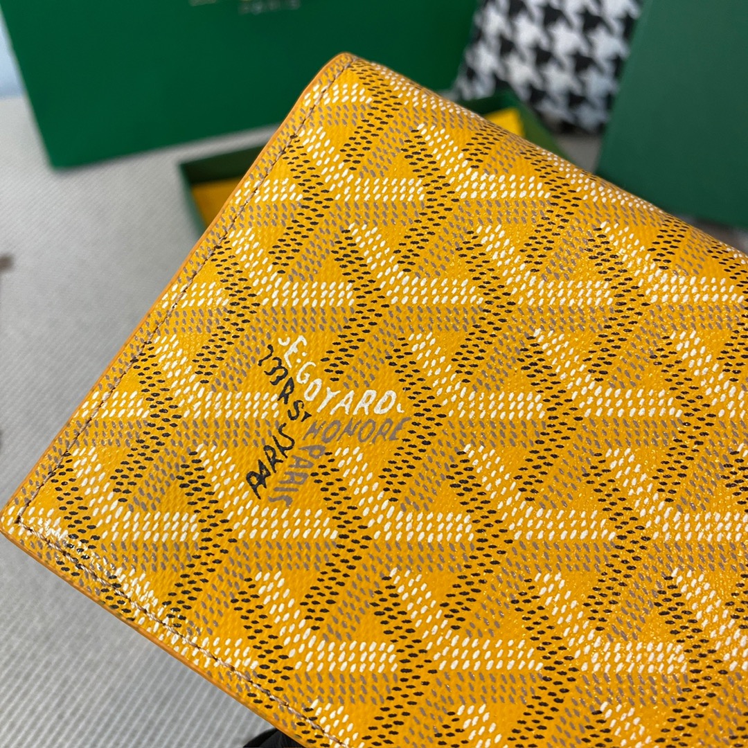 yellow goyard Richelieu Wallet a long wallet that fastens with a snap fastener