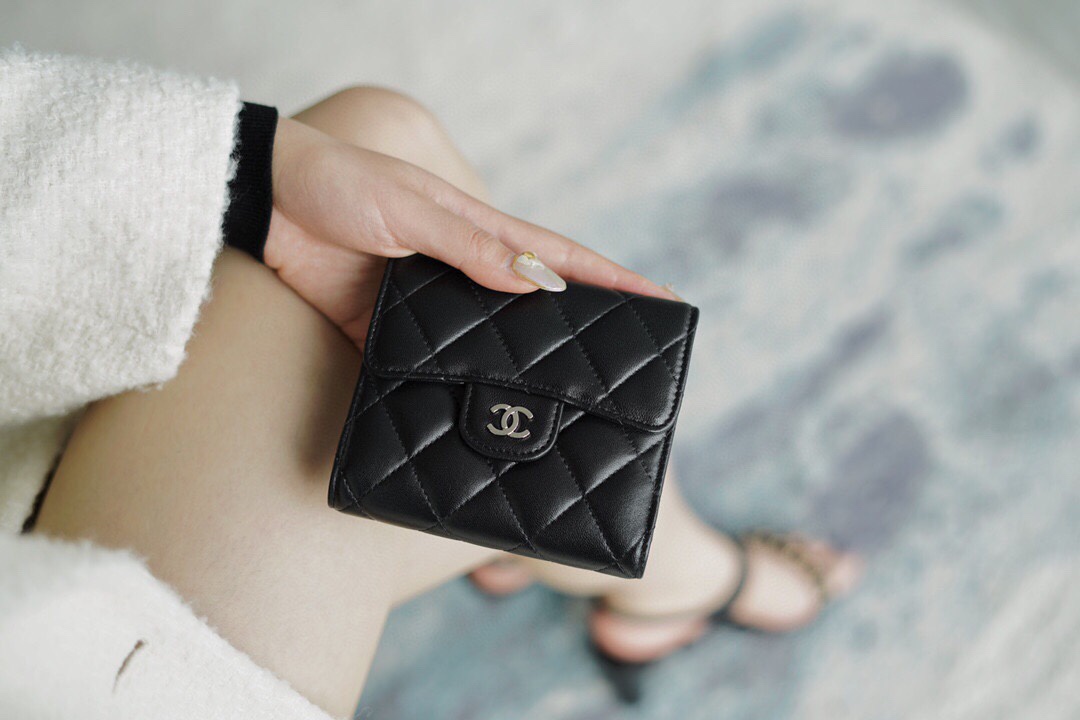 Chanel classic trifold short clip black lamb silver delicate lambskin has a kind of innate charm
