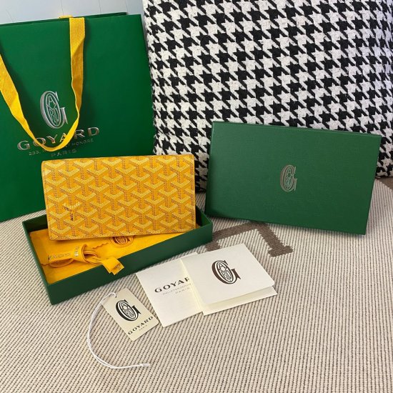 yellow goyard Richelieu Wallet a long wallet that fastens with a snap fastener