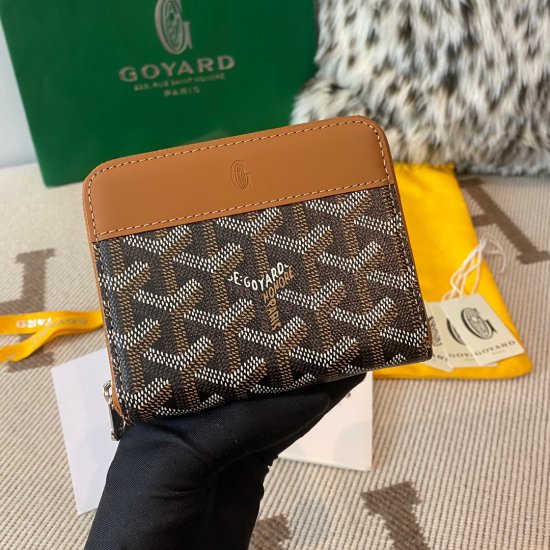 Black and tan Goyard Matignon PM Wallet is a compact shape and closes securely with a zip