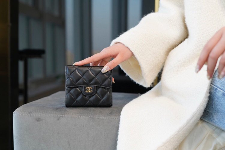 Chanel classic trifold short clip black sheep gold delicate lambskin has a kind of innate charm